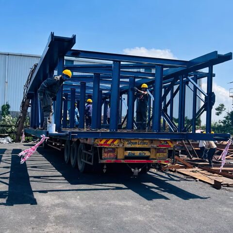 Transport logistics for a large industrial steel structure being moved on a truck trailer.